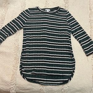 Green white and black shirt